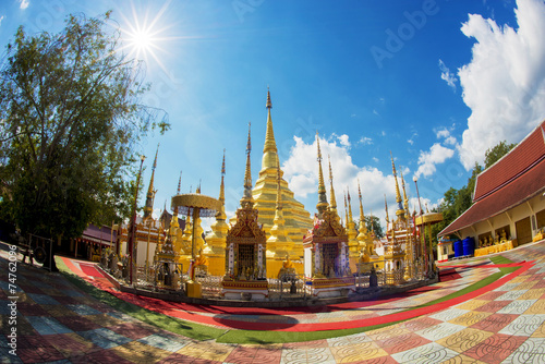 Pagoda and sunstar in thailand temple photo