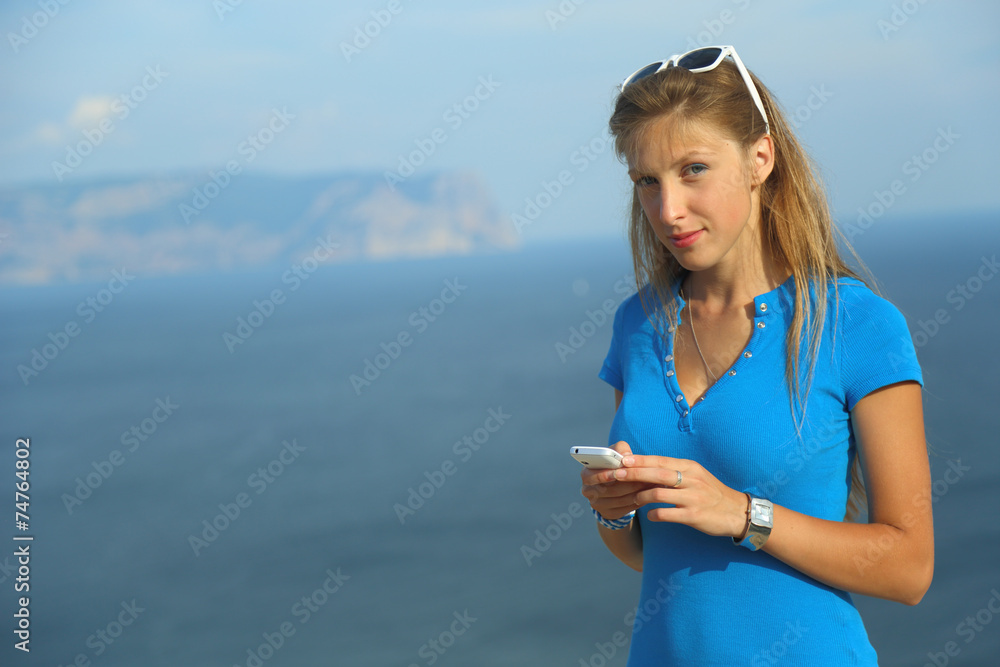 beautiful girl on a background of mountain Coast