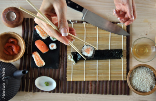 hands cooking sushi