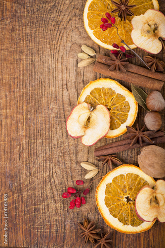 Christmas spices and dried orange sliceson photo