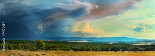 Panorama of  dark storm coming over a town photo