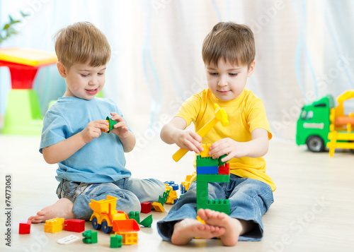 Kids playing toys in playroom at nursery