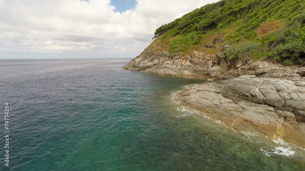 Flying along the rocky coast.