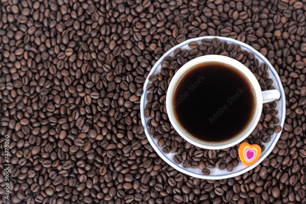 cup of coffee with heart on the background of coffee cup of coffee with heart on the background of coffee