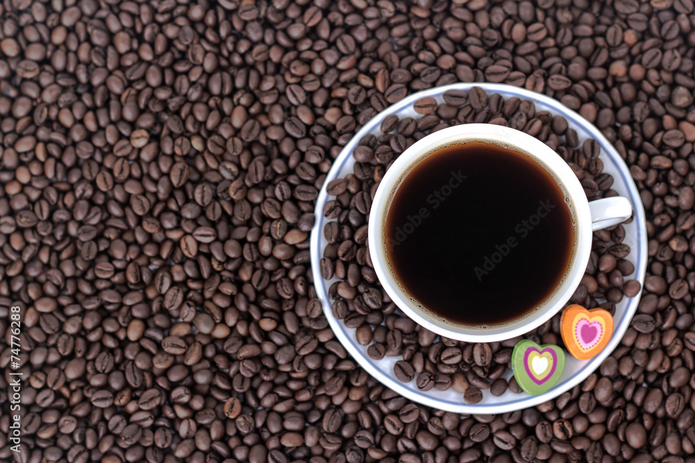 cup of coffee with heart on the background of coffee cup of coffee with heart on the background of coffee