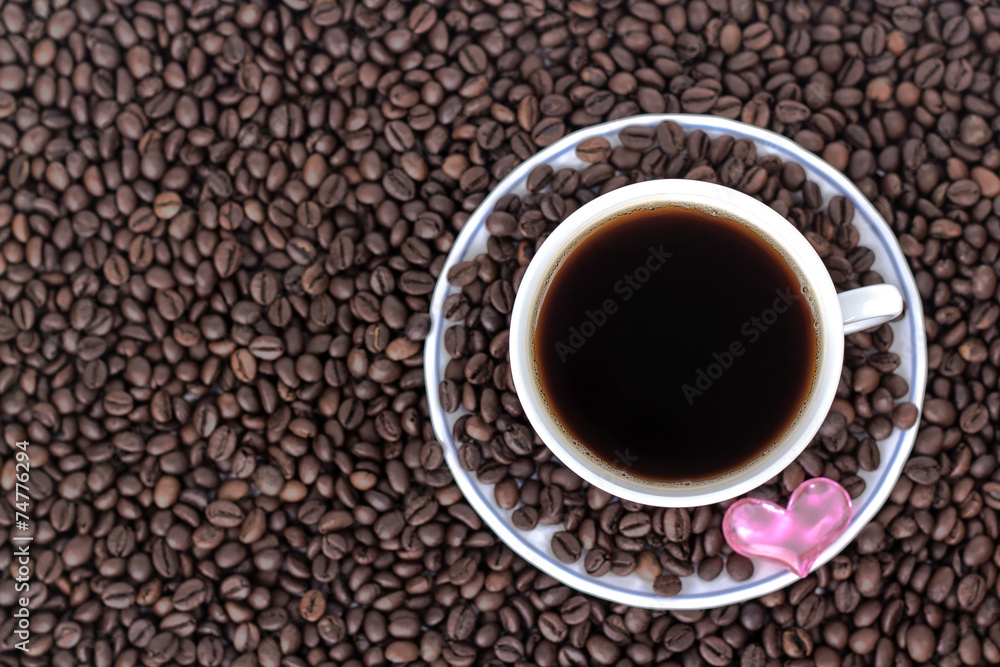 cup of coffee with heart on the background of coffee cup of coffee with heart on the background of coffee