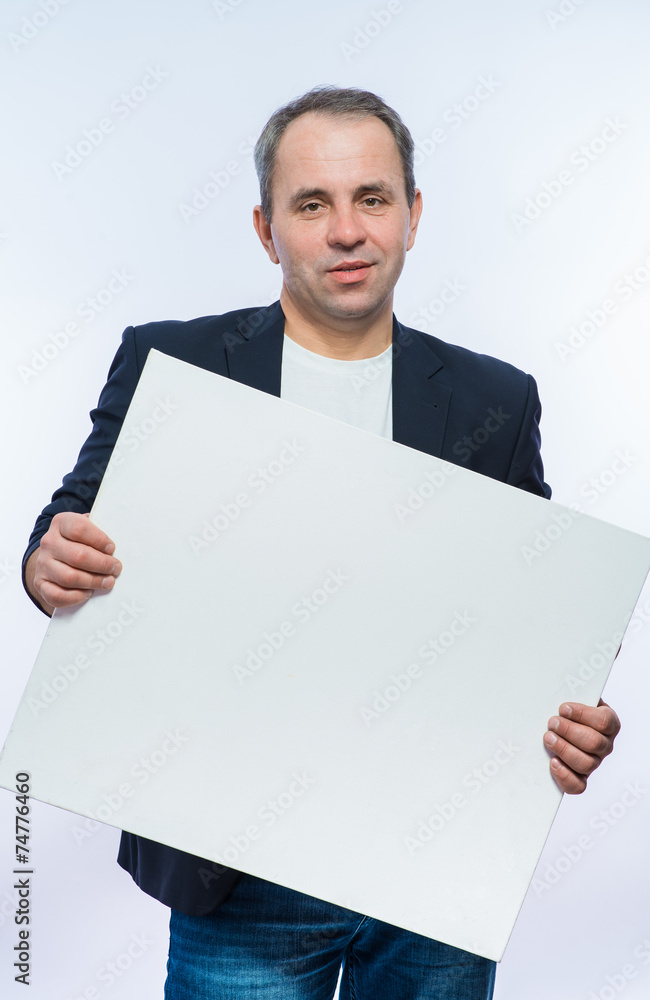 Businessman holding a poster Businessman holding a poster