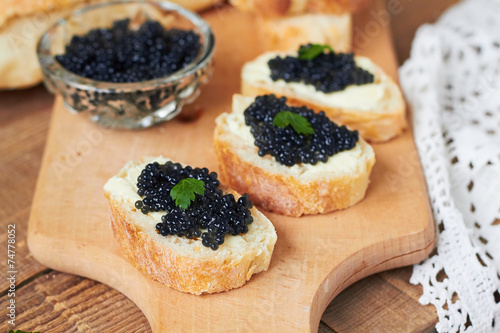 Black caviar on a slice of bread