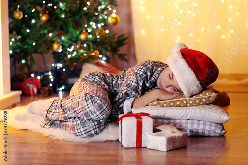 Little boy sleeping near fi...