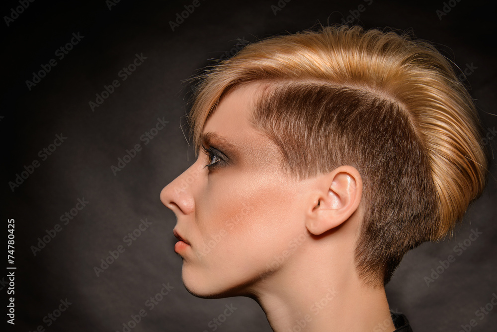 © Shadow - Girl with short hair on a dark background