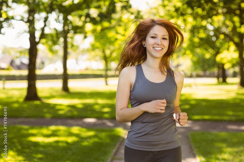 Portrait of a pretty redhead running Portrait of a pretty redhead running
