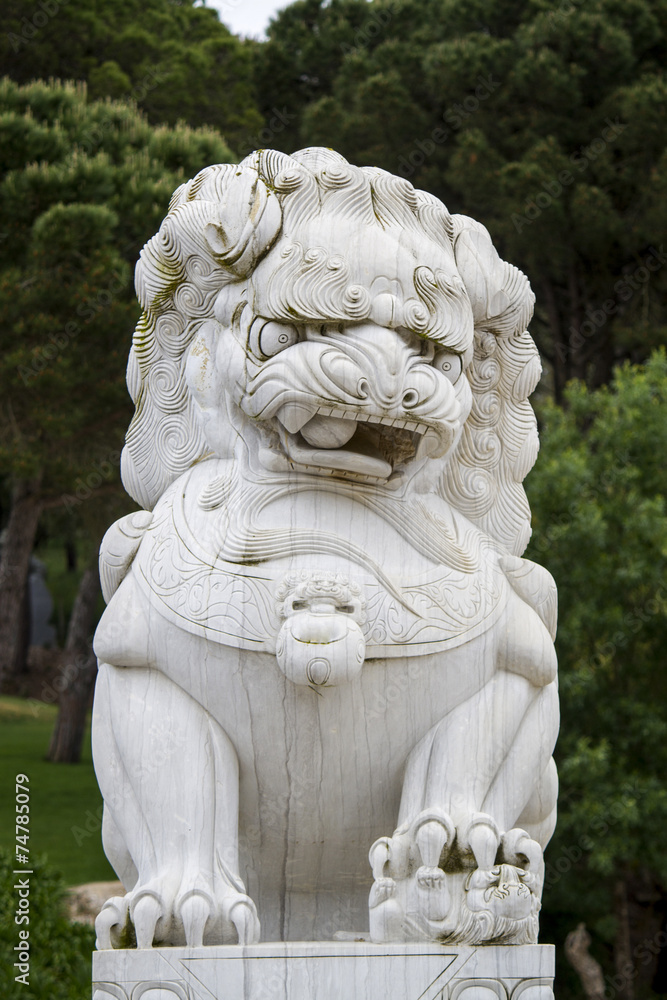 Close up view of a beautiful lion statue on a park.