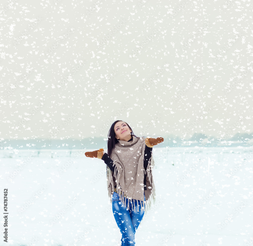 happy woman walking in a field on a winter evening happy woman walking in a field on a winter evening