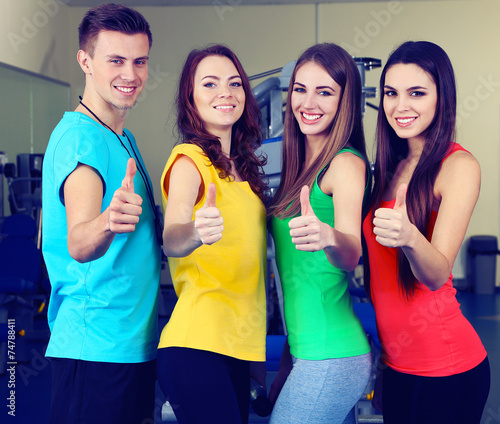 Young beautiful peoples in gym