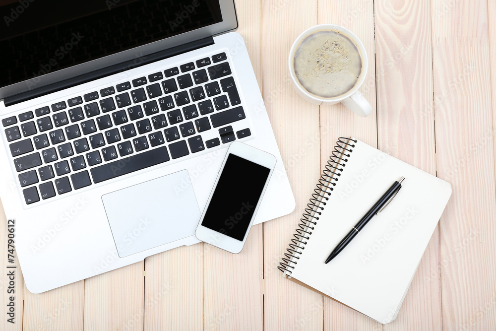 Open notebook, smart phone, diary and a cup of coffee Open notebook, smart phone, diary and a cup of coffee