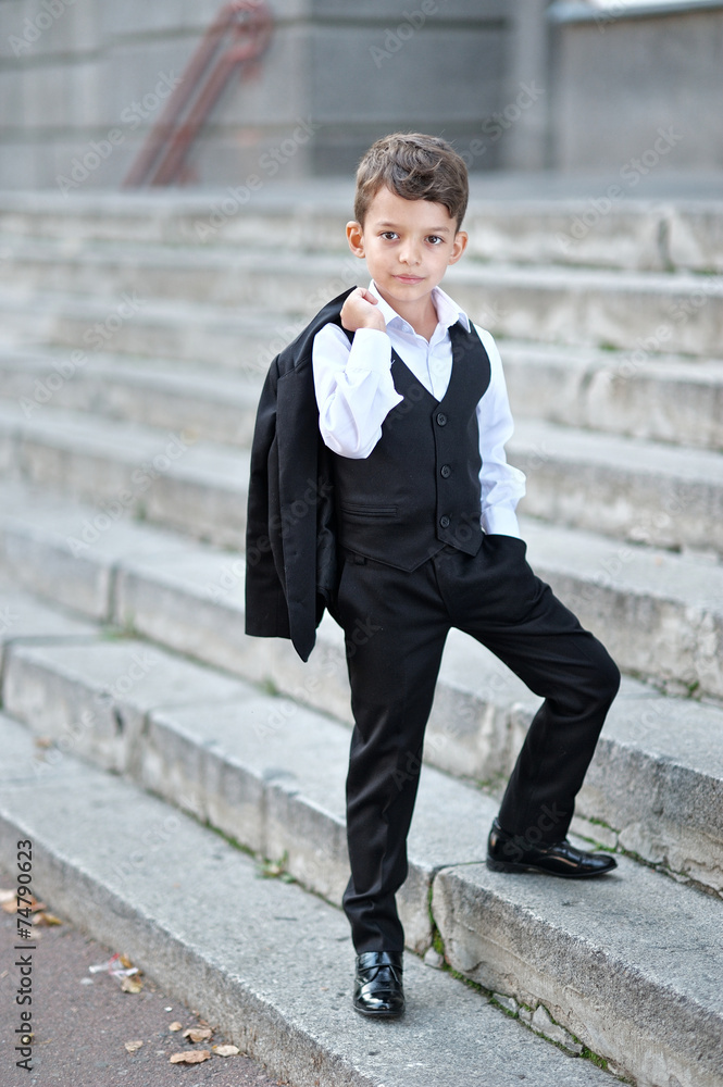 portrait of a little boy in a business style portrait of a little boy in a business style