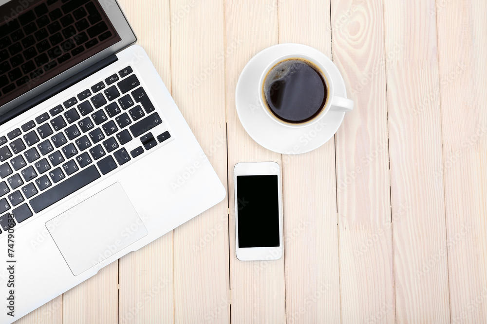 Open notebook, digital tablet, diary, smart phone and a cup of Open notebook, digital tablet, diary, smart phone and a cup of