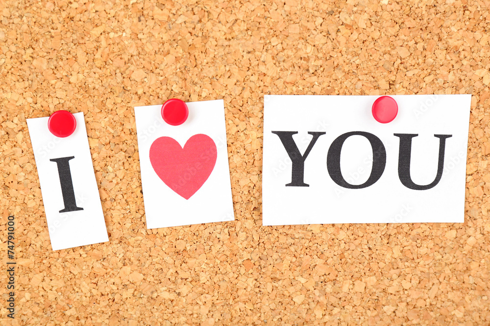 Paper sheets with declaration of love on wooden background Paper sheets with declaration of love on wooden background