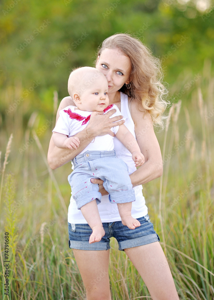 Fototapeta premium portrait of a happy family on summer nature