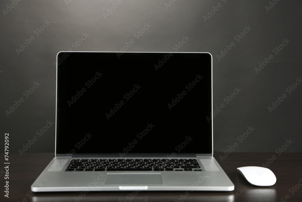 Modern laptop on table, close up Modern laptop on table, close up