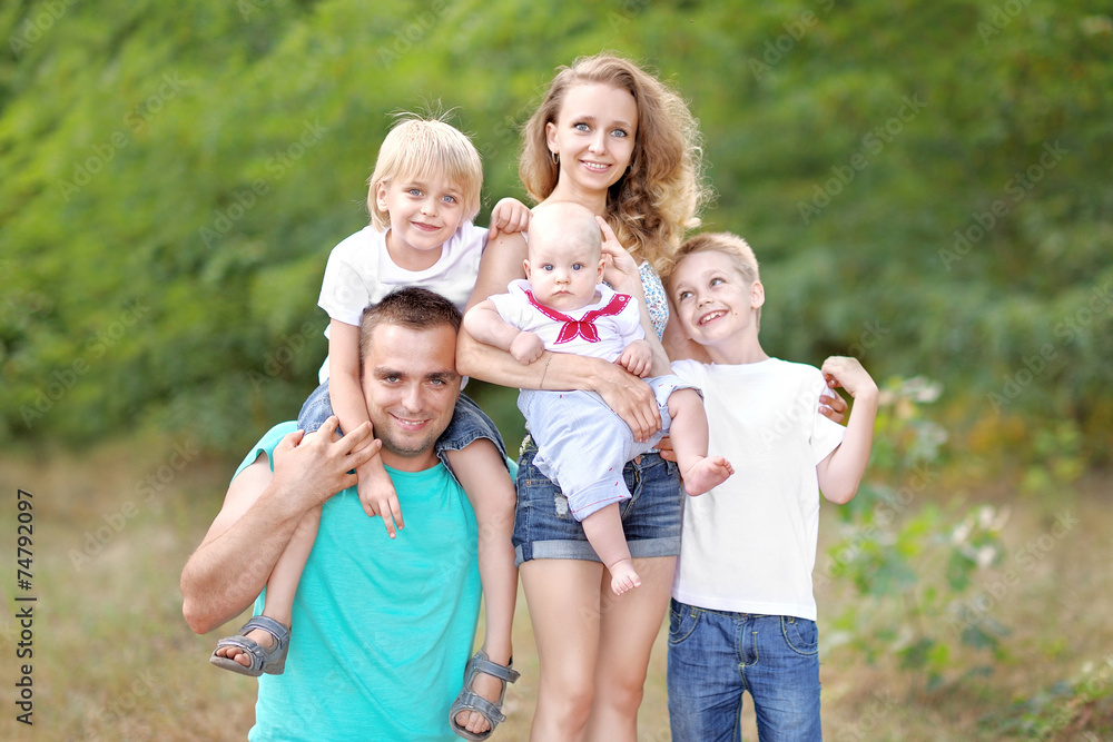 portrait of a happy family on summer nature portrait of a happy family on summer nature