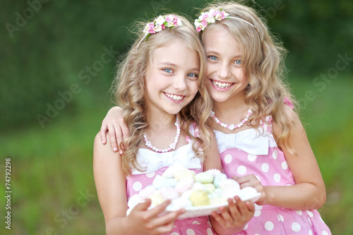 Portrait of two little girls twins
