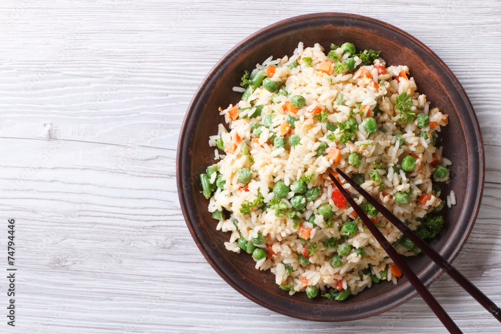 Japanese fried rice with green peas and eggs horizontal top view Japanese fried rice with green peas and eggs horizontal top view