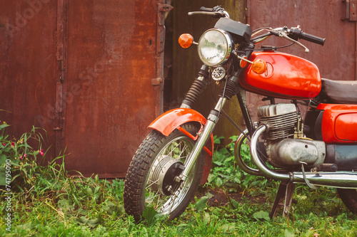 Fototapeta Naklejka Na Ścianę i Meble -  Vintage Red Motorcycle Generic Motorbike In Countryside