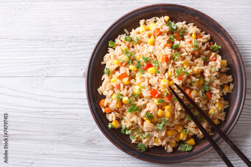 fried rice with eggs, corn and spice closeup horizontal top view