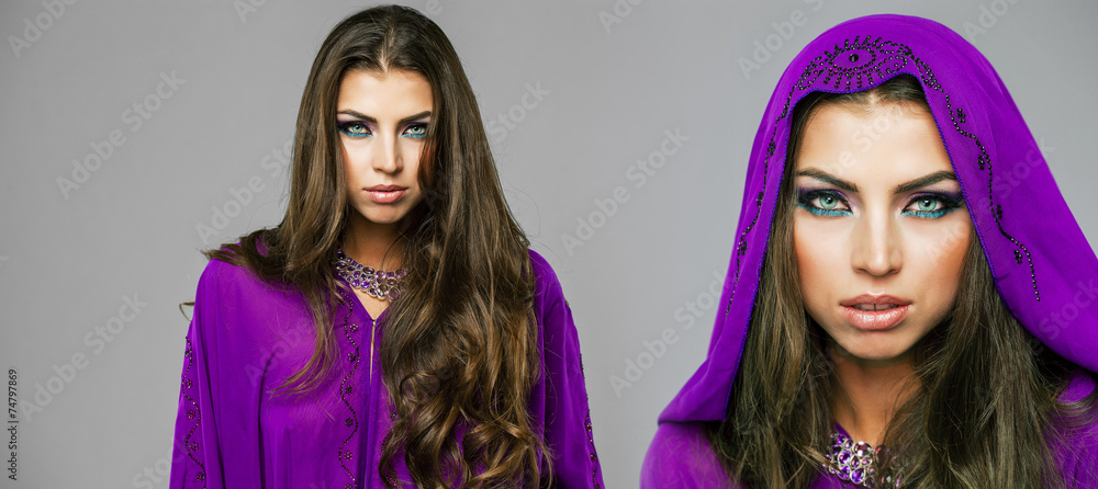 Obraz premium Two young sexy women in purple tunic Arabic