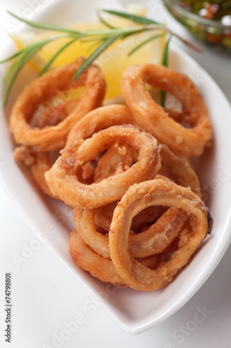 Squid  rings with lemon and rosemary