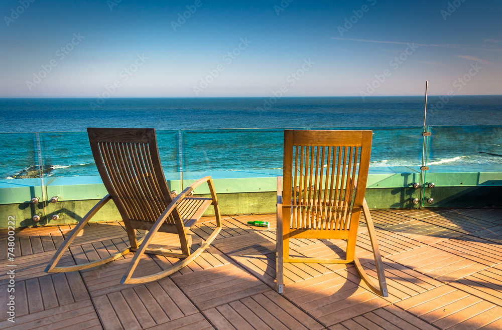 Chairs on a balcony overlooking the Atlantic Ocean at Revel Hote
