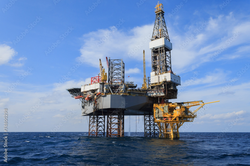 Offshore Jack Up Drilling Rig Over The Production Platform in Th