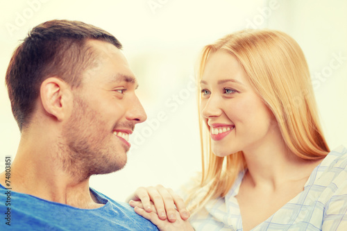smiling happy couple at home