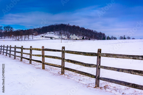 Fence and snow covered farm fields in rural Adam's County, Penns photo