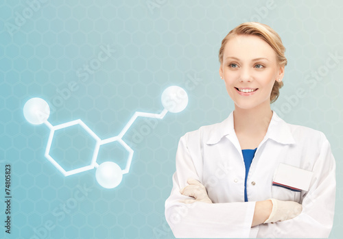 smiling female doctor with molecule of serotonin photo