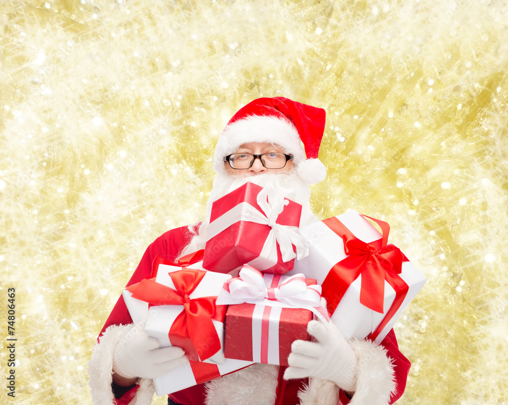man in costume of santa claus with gift boxes man in costume of santa claus with gift boxes