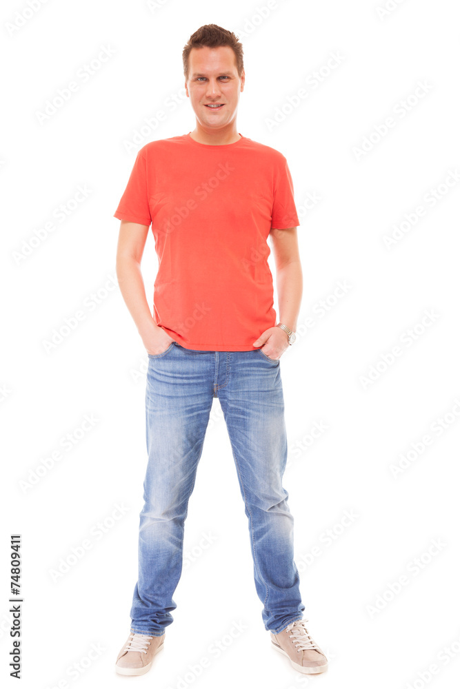 Young man guy red t-shirt jaens with hands in pockets isolated Young man guy red t-shirt jaens with hands in pockets isolated