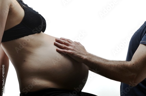man hands touching his pregnant woman on white background