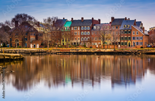 Reflections of waterfront buildings along the Potomac River in A