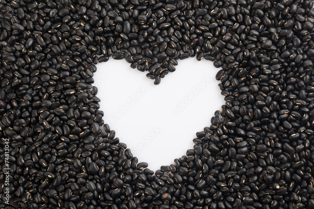 Black beans with heart shape space Black beans with heart shape space