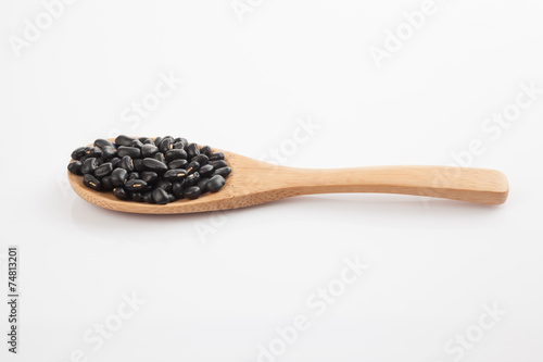 Black beans with wooden spoon