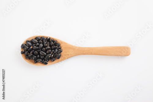 Black beans with wooden spoon