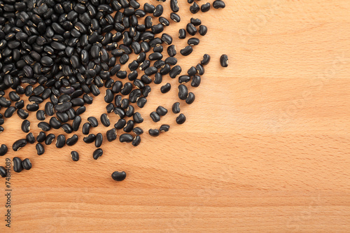 Black beans on wood table