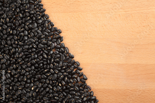 Black beans on wood table