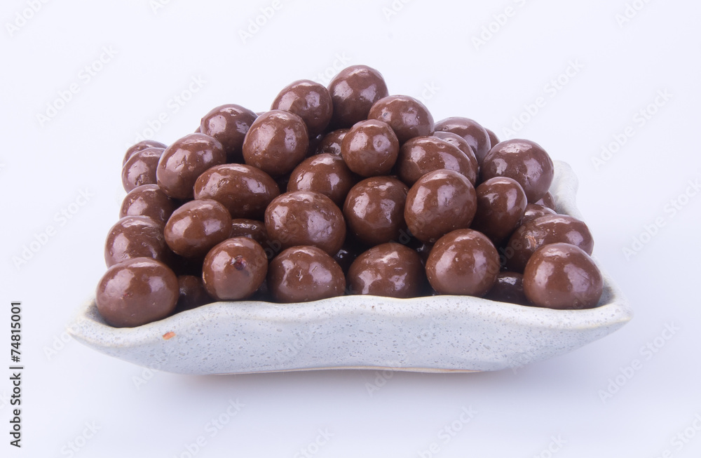 chocolate balls. chocolate balls in bowl on a background chocolate balls. chocolate balls in bowl on a background
