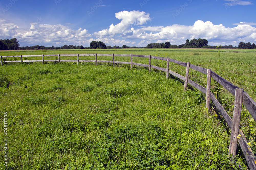 farmland landscape with wooden fence