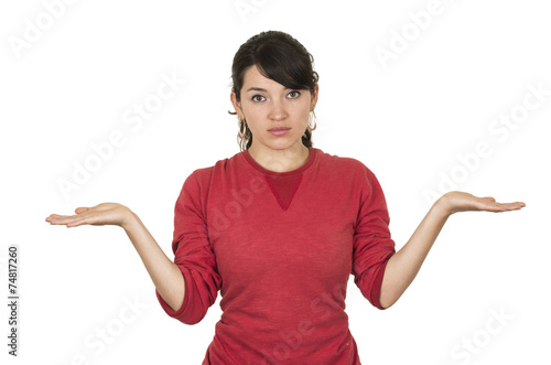 Obraz na plátně pretty young girl wearing red top posing with palms up looking