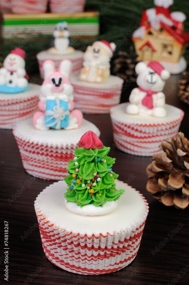 Sugar figurine Christmas tree on the muffin
