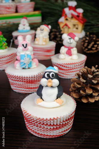 Sugar Christmas penguin figurine on a muffin